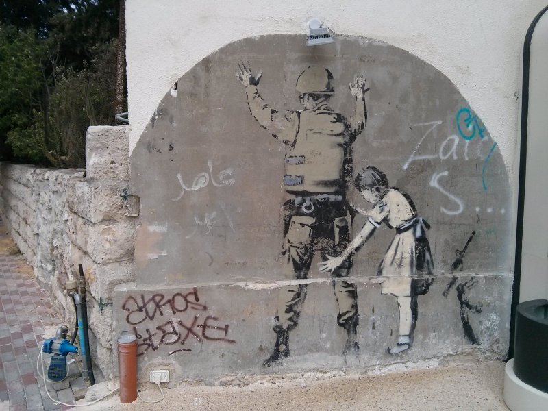 "Girl and a Soldier" by Banksy